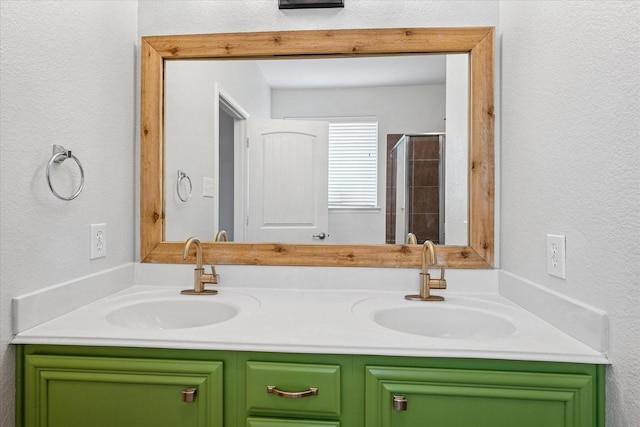 5208 Hidden Knolls Dr, Mckinney, TX 75071 - full bath featuring double vanity, a textured wall, and a shower with shower door
