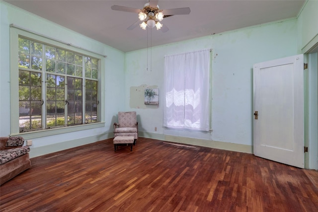 unfurnished room with wood finished floors and ceiling fan