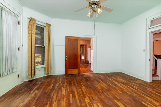 unfurnished room featuring hardwood / wood-style flooring, ornamental molding, and ceiling fan