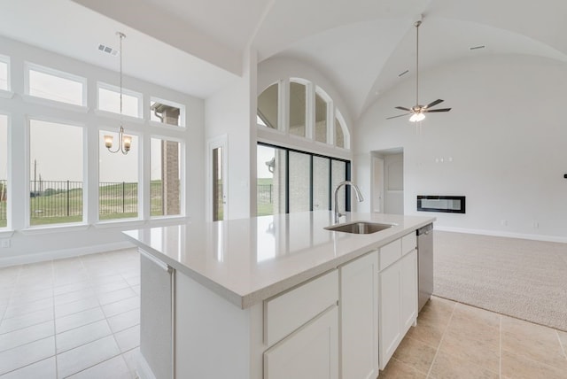 1006 Cascading Creek Dr, Rockwall, TX 75087 - kitchen featuring a sink, open floor plan, healthy amount of natural light, baseboards, and high vaulted ceiling