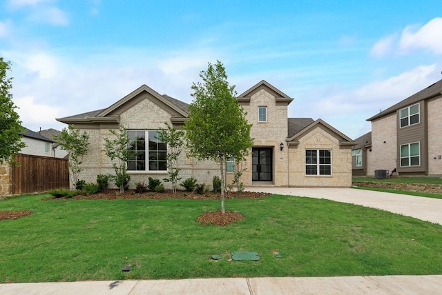 1006 Cascading Creek Dr, Rockwall, TX 75087 - view of front of house featuring brick siding and central air condition unit