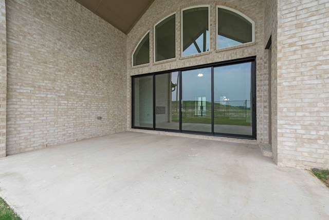 1006 Cascading Creek Dr, Rockwall, TX 75087 - doorway to property featuring a patio area and brick siding