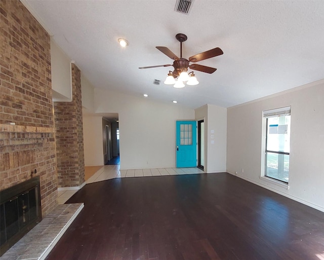 unfurnished living room featuring vaulted ceiling, visible vents, light wood finished floors, and ceiling fan