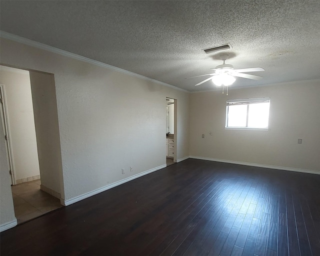 unfurnished room featuring crown molding, a ceiling fan, visible vents, and wood-type flooring