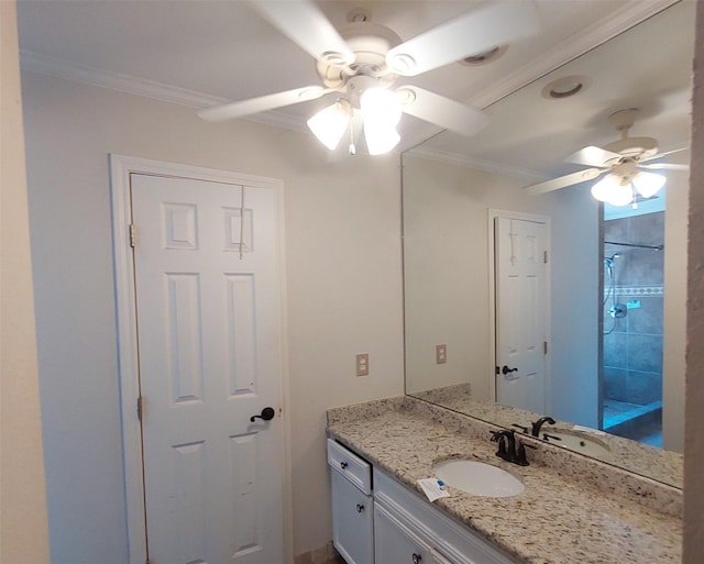 bathroom with a ceiling fan, vanity, and ornamental molding