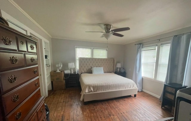 bedroom with ceiling fan, baseboards, ornamental molding, and wood-type flooring