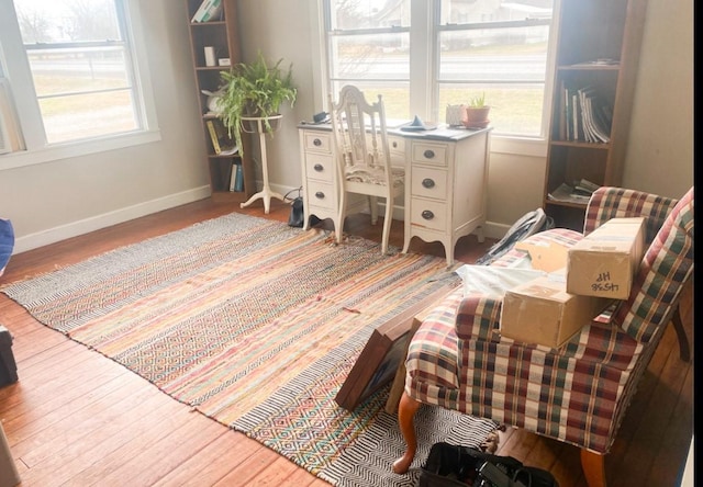 interior space featuring baseboards and wood finished floors