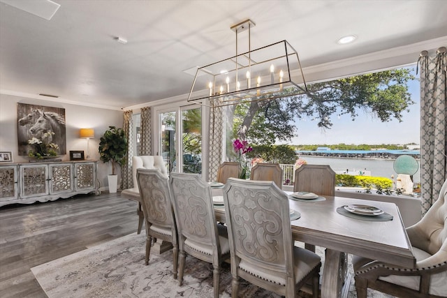 7909 Bal Harbour Ct, Fort Worth, TX 76179 - dining space with ornamental molding, a chandelier, plenty of natural light, wood finished floors, and a water view