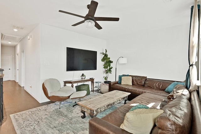 living area featuring attic access, visible vents, recessed lighting, a ceiling fan, and wood finished floors