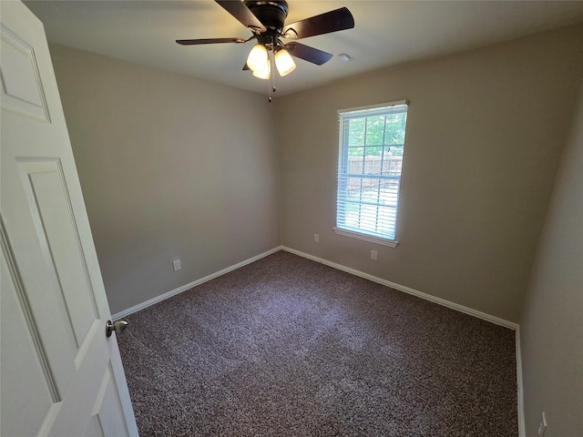 unfurnished room featuring a ceiling fan, carpet, and baseboards