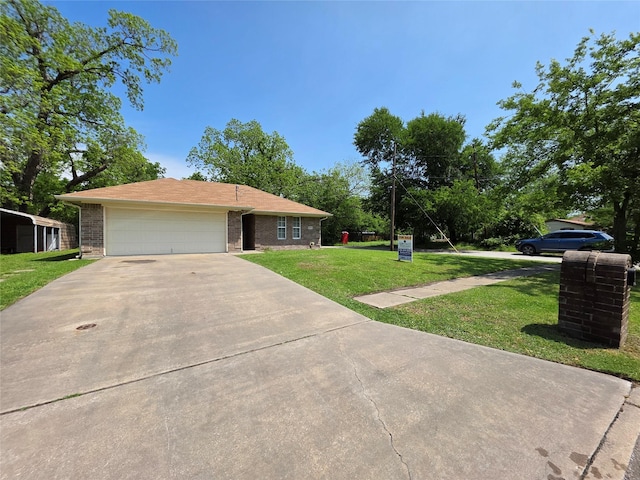 ranch-style house with brick siding, a front yard, concrete driveway, and an attached garage