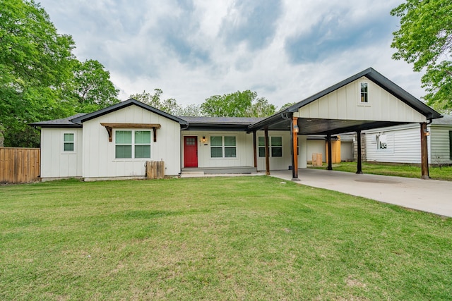 ranch-style home featuring board and batten siding, a front lawn, driveway, and fence