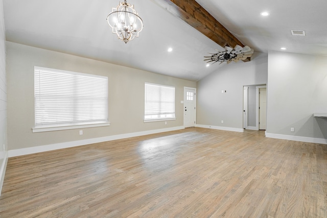 unfurnished living room with lofted ceiling with beams, an inviting chandelier, light wood-style flooring, baseboards, and visible vents