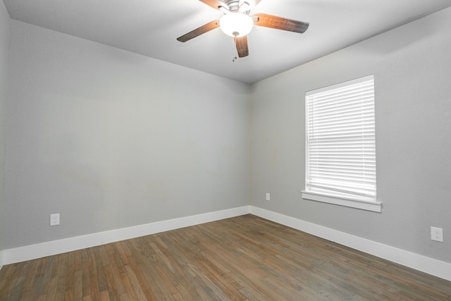 spare room with ceiling fan, baseboards, and wood finished floors