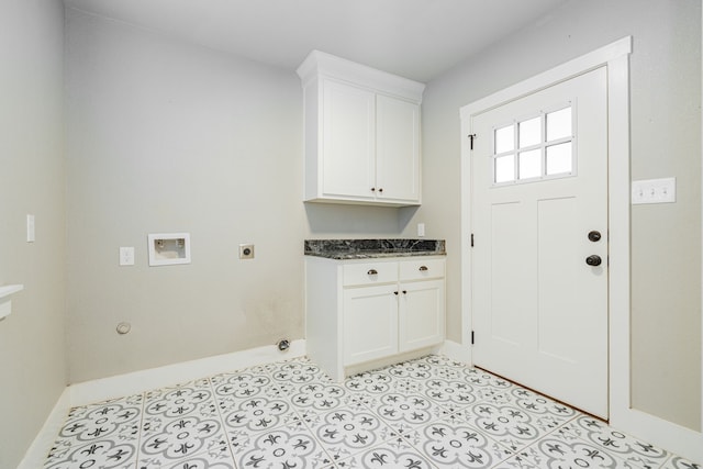 washroom featuring electric dryer hookup, baseboards, cabinet space, and hookup for a washing machine