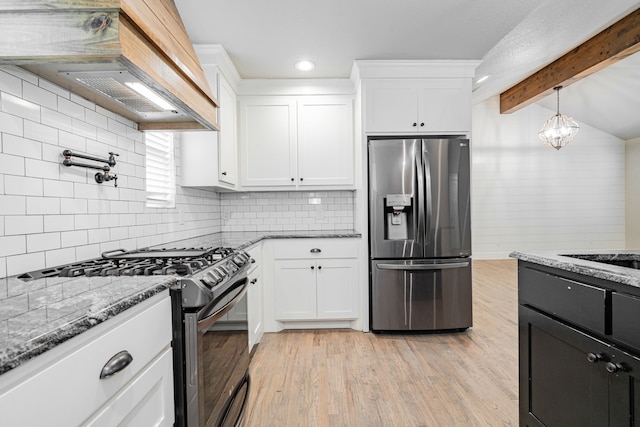 kitchen with light wood finished floors, beam ceiling, appliances with stainless steel finishes, custom exhaust hood, and white cabinetry