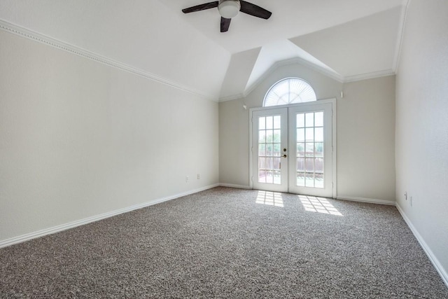 empty room with vaulted ceiling, french doors, baseboards, carpet flooring, and ceiling fan