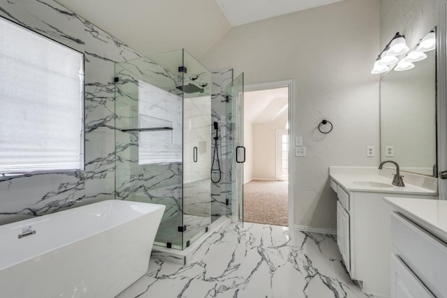 bathroom featuring a marble finish shower, a freestanding tub, vanity, marble finish floor, and baseboards