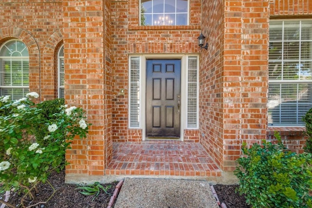 entrance to property with brick siding