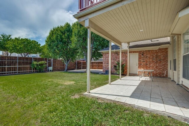 view of yard with a fenced backyard and a patio