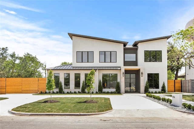 11736 Jamestown Rd, Dallas, TX 75230 - contemporary home with a standing seam roof, metal roof, and stucco siding