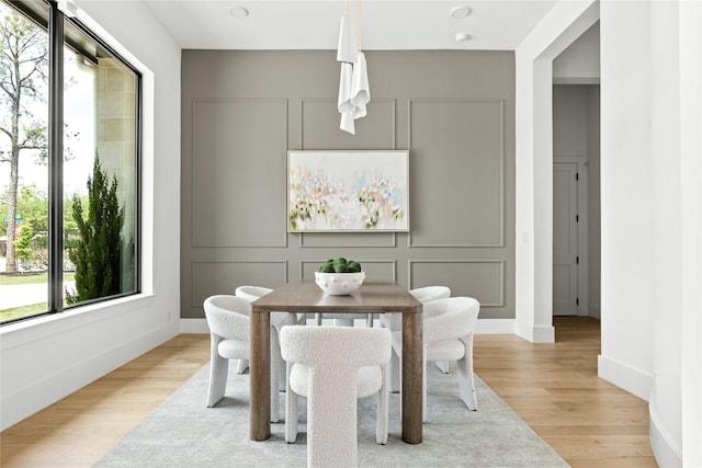 11736 Jamestown Rd, Dallas, TX 75230 - dining room with light wood finished floors and baseboards