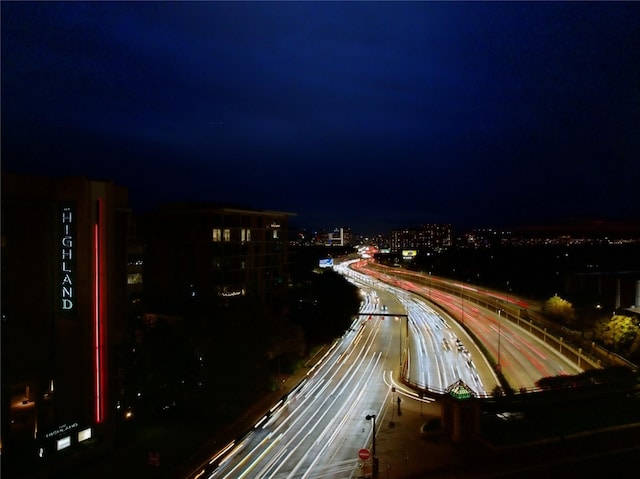 exterior space with a view of city lights