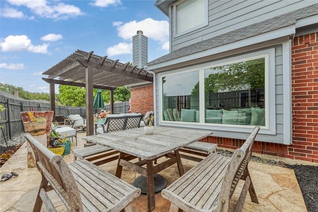 view of patio featuring a pergola, a fenced backyard, and outdoor dining area