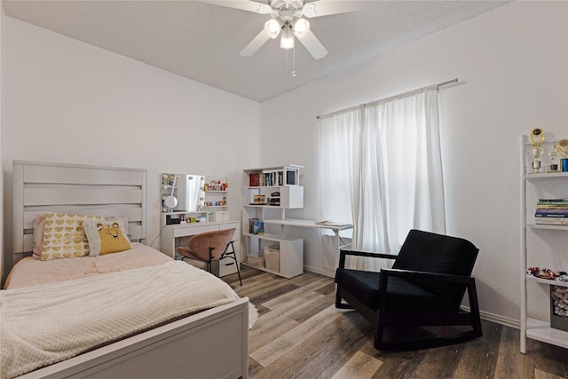 bedroom with wood finished floors, baseboards, and ceiling fan