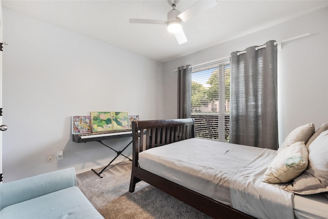 bedroom featuring baseboards, a ceiling fan, and carpet