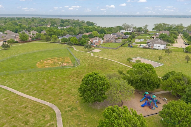 drone / aerial view with a water view and a residential view