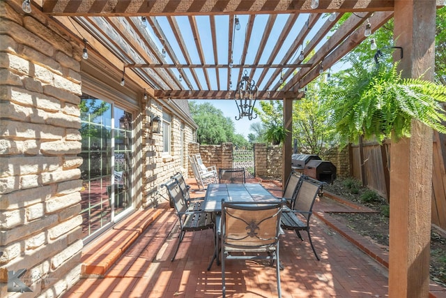view of patio featuring a pergola, outdoor dining space, a fenced backyard, and a grill