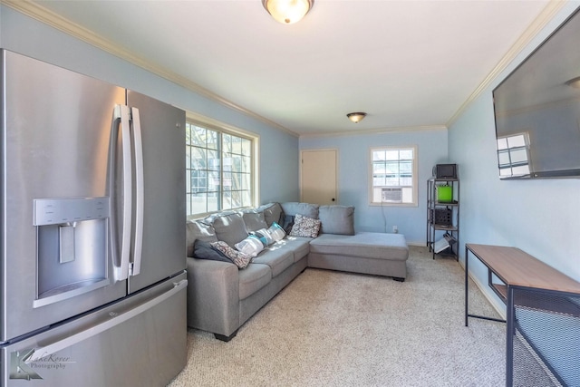 living area with crown molding, baseboards, and light carpet