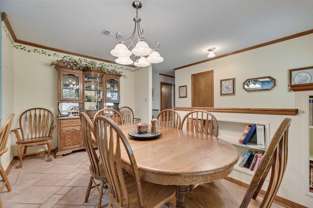 dining area featuring baseboards, visible vents, a chandelier, and ornamental molding