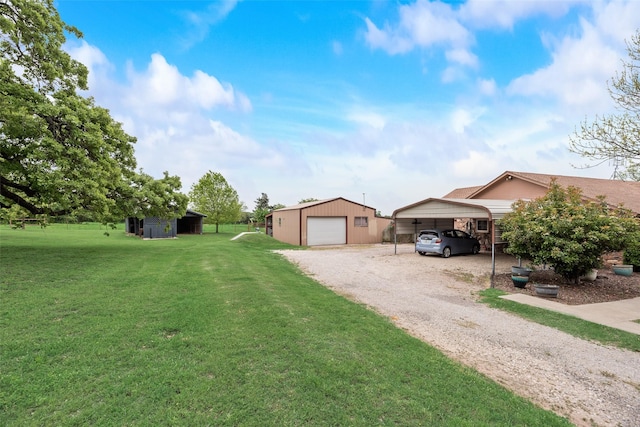 view of front of house with a detached carport, a front lawn, a detached garage, an outdoor structure, and gravel driveway