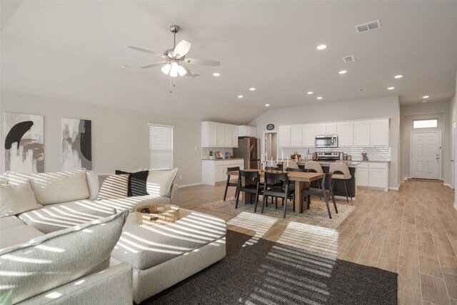 5753 Brookville Dr, Fort Worth, TX 76179 - living area with light wood-type flooring, recessed lighting, a ceiling fan, baseboards, and lofted ceiling