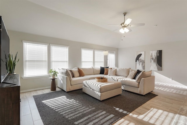 5753 Brookville Dr, Fort Worth, TX 76179 - living room with healthy amount of natural light, a ceiling fan, baseboards, vaulted ceiling, and wood finished floors