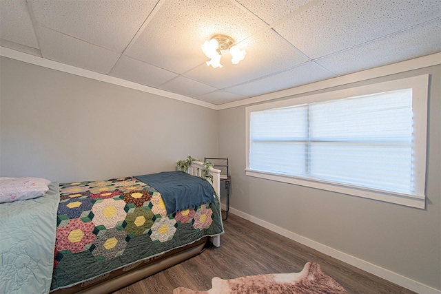 266 Yorkshire Dr, Gordonville, TX 76245 - bedroom featuring baseboards, wood finished floors, a drop ceiling, and crown molding