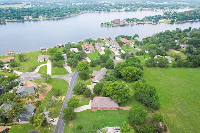 drone / aerial view with a residential view and a water view