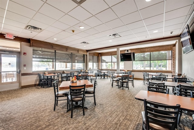 dining room featuring carpet floors, visible vents, and baseboards