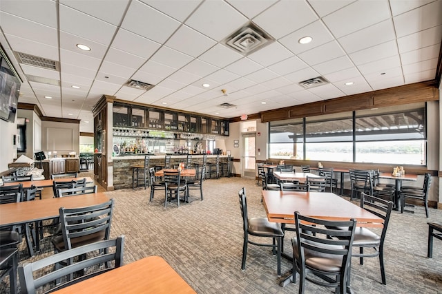 dining space featuring visible vents and carpet flooring