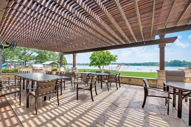 view of patio / terrace with a pergola, a water view, and outdoor dining space
