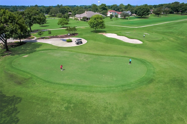 surrounding community featuring view of golf course