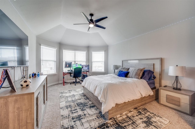 bedroom featuring baseboards, ceiling fan, vaulted ceiling, and light colored carpet