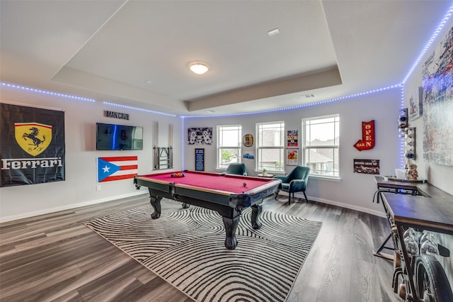 playroom featuring a raised ceiling, wood finished floors, and pool table