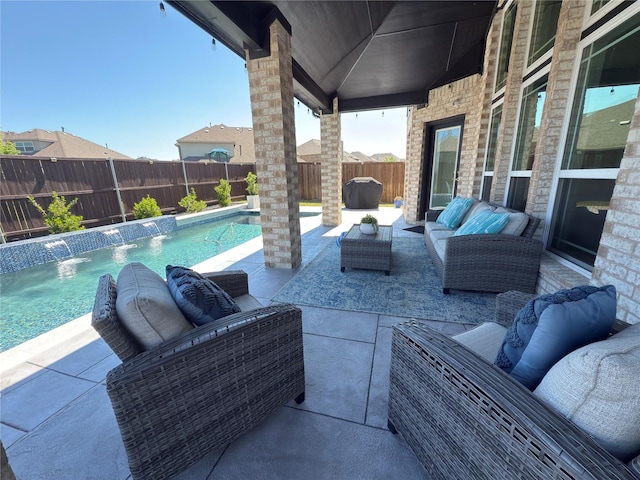 view of patio / terrace featuring an outdoor living space, a fenced backyard, grilling area, and a fenced in pool