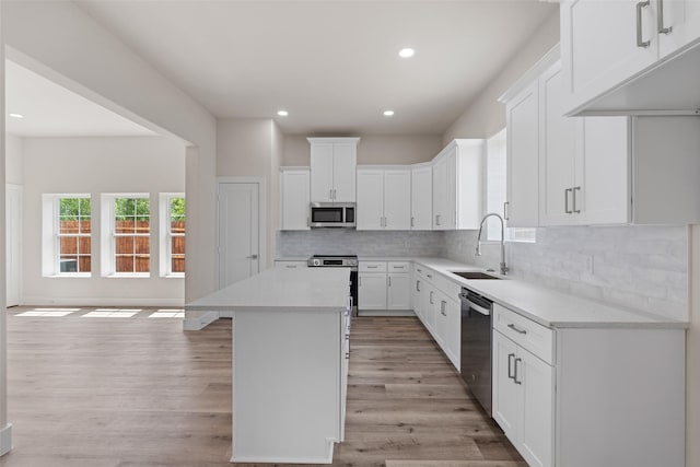 5426 Van Horn Dr, Granbury, TX 76048 - kitchen featuring recessed lighting, stainless steel appliances, light countertops, a sink, and tasteful backsplash