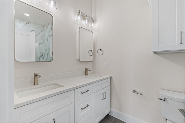 5426 Van Horn Dr, Granbury, TX 76048 - full bath featuring double vanity, tile patterned floors, toilet, and a sink