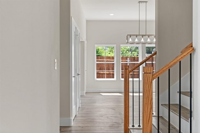 5426 Van Horn Dr, Granbury, TX 76048 - hallway featuring baseboards, wood finished floors, recessed lighting, and stairs
