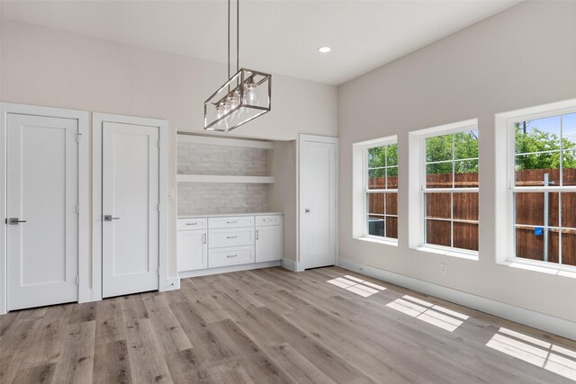5426 Van Horn Dr, Granbury, TX 76048 - unfurnished dining area with light wood finished floors, baseboards, and recessed lighting